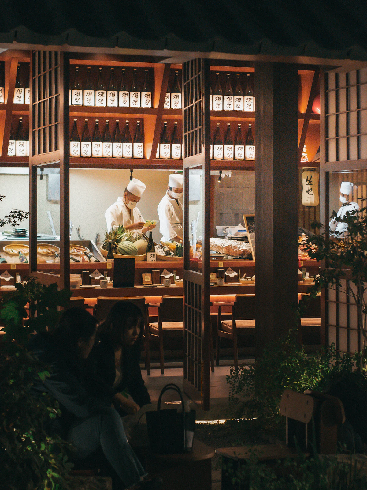 Japanese restaurant interior with chefs at work
