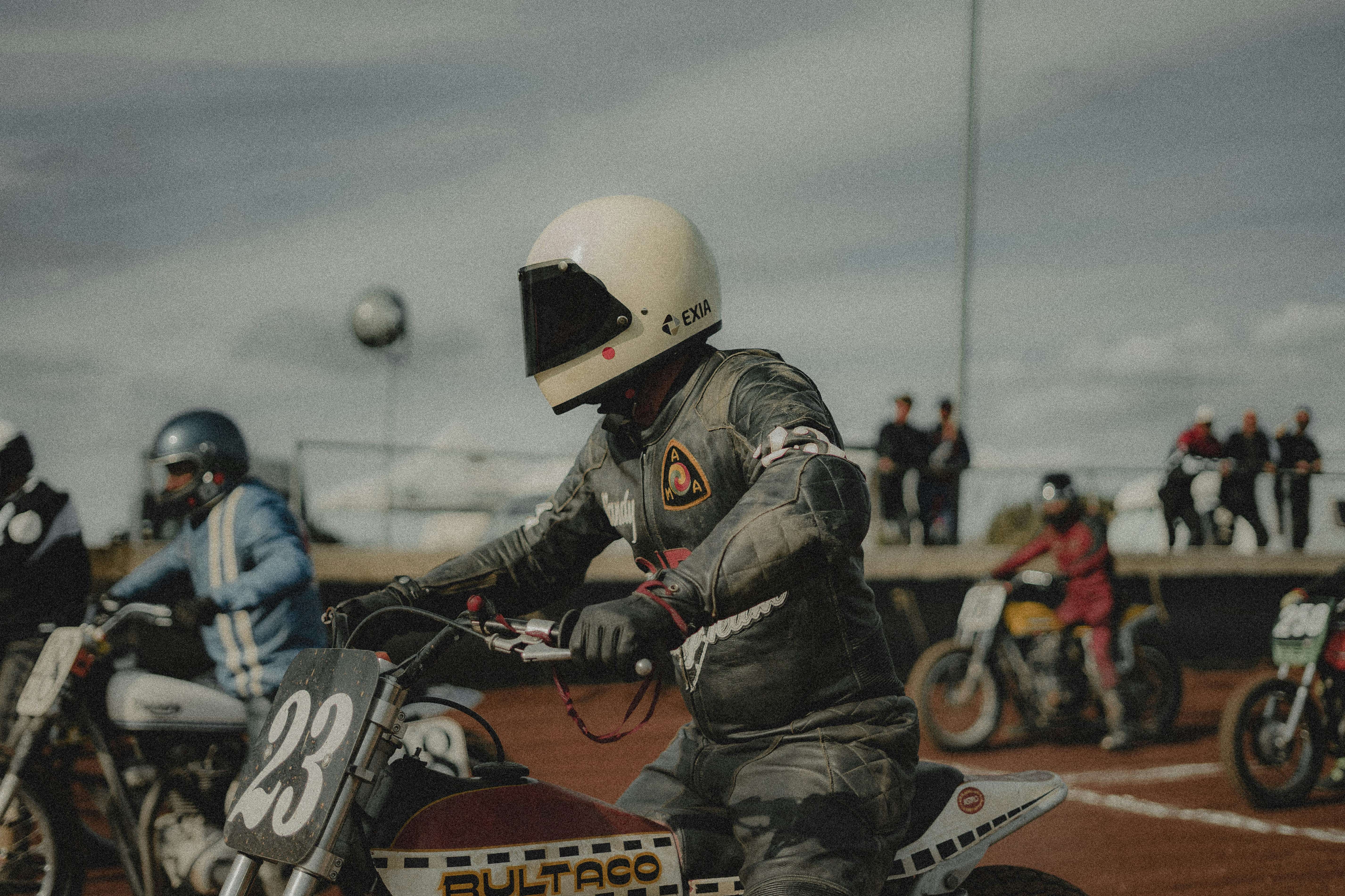 Motorcyclists line up at the race starting line.
