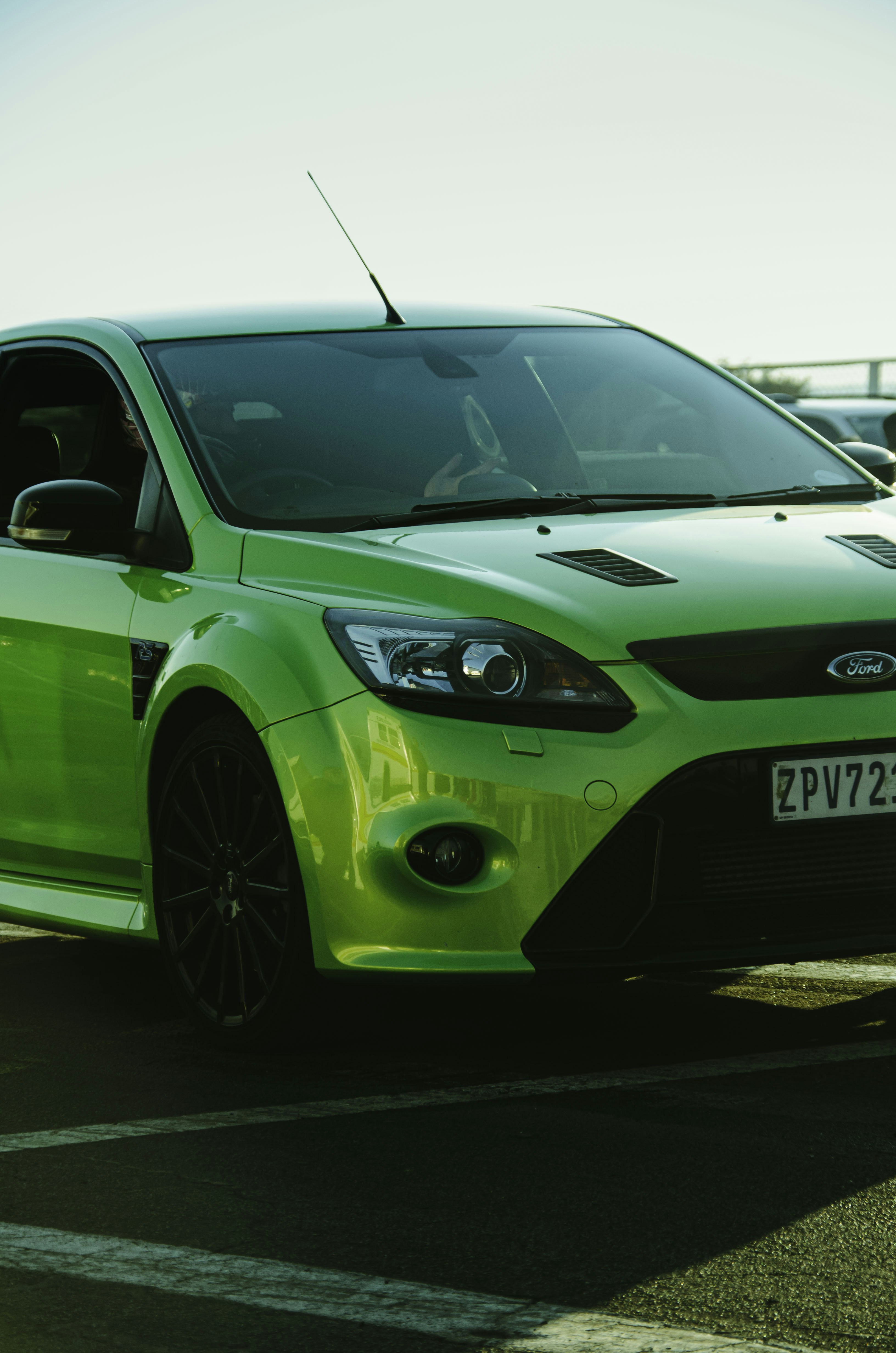 A bright green ford focus.