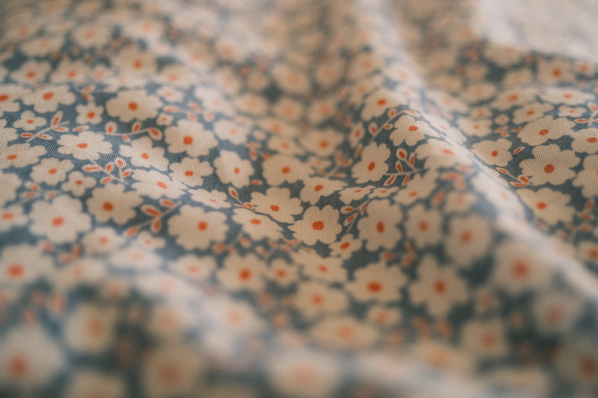 Cloth with small white flowers is visible.