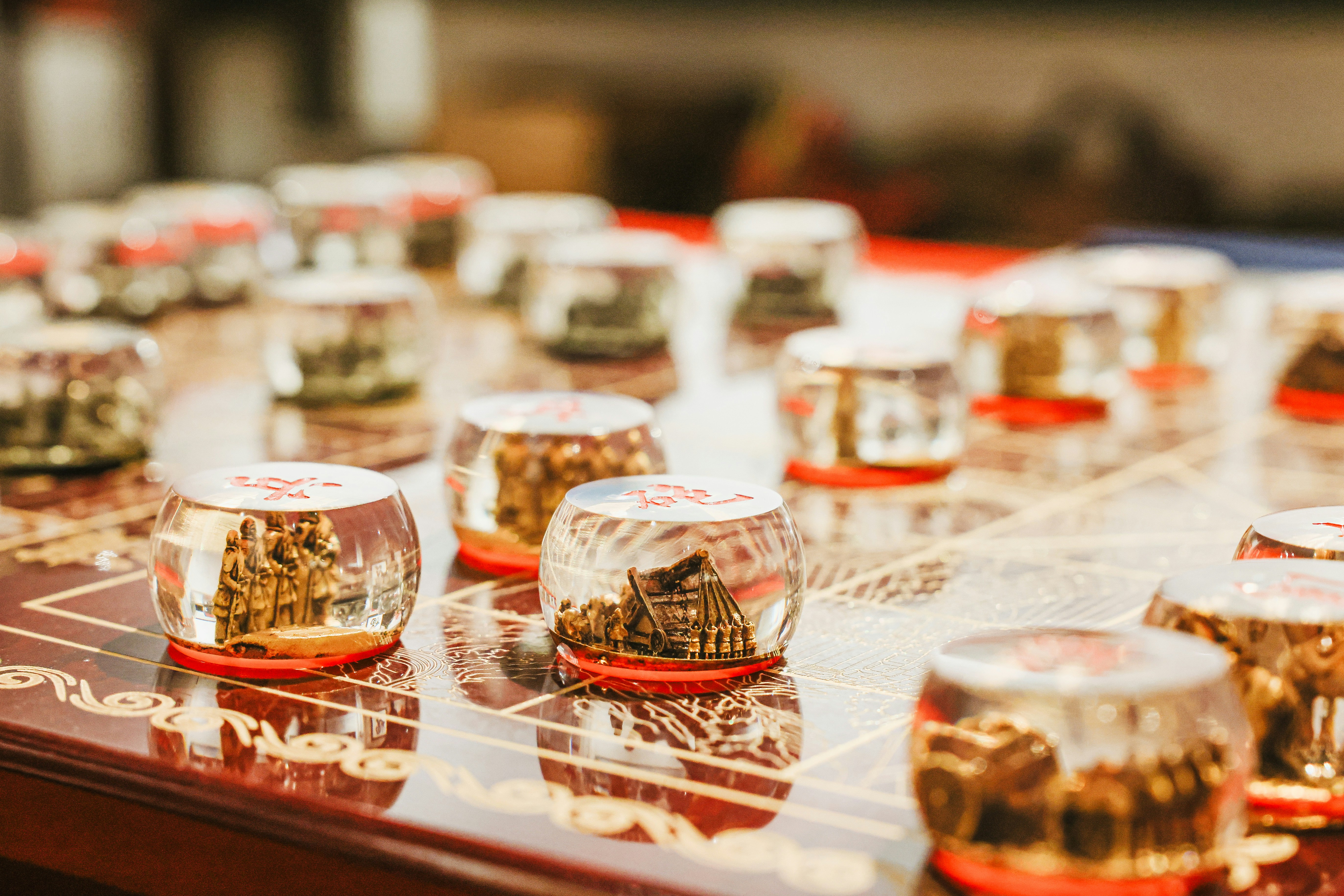 A unique chess set on a glossy table.