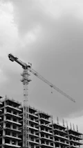 A building is under construction with a crane.