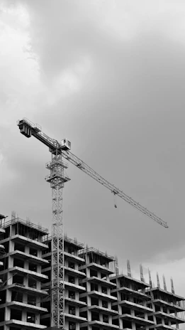 A building is under construction with a crane.