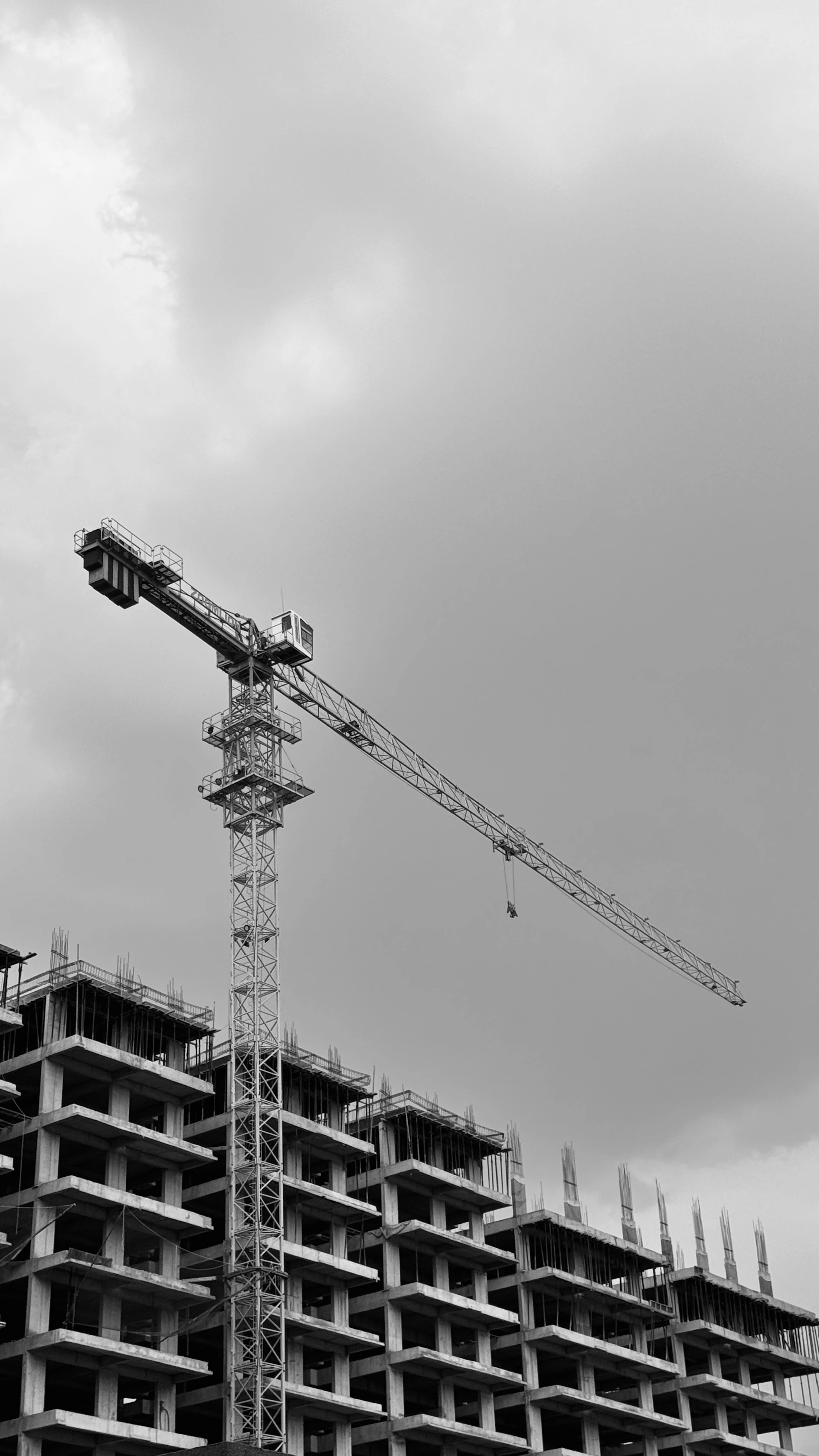 A building is under construction with a crane.
