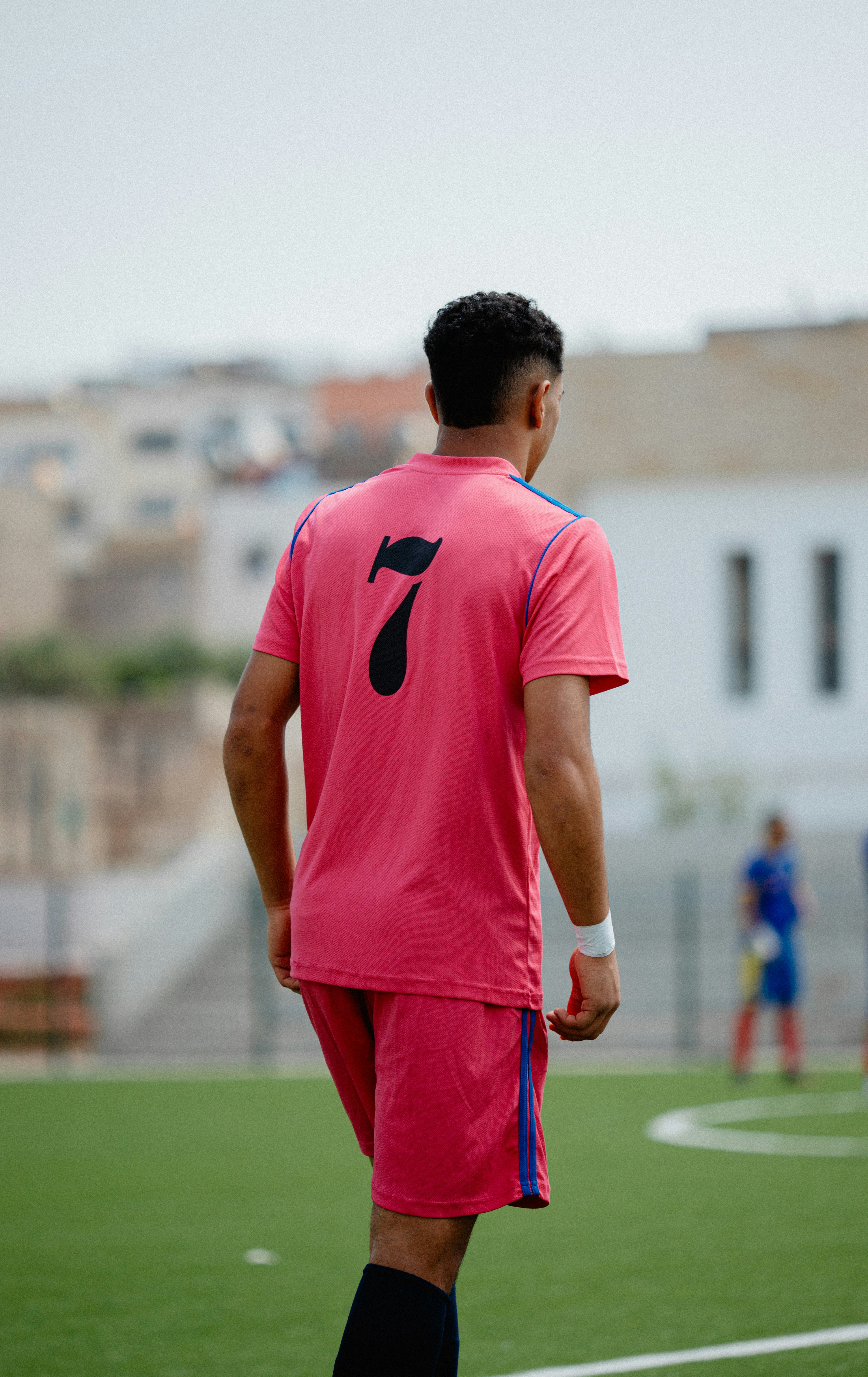 Soccer player with the number seven on their back.
