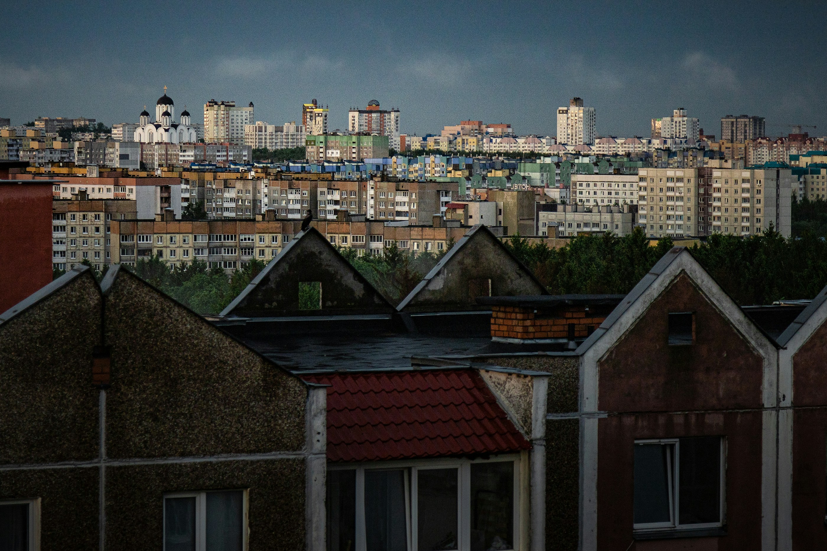 Cityscape view with a mix of rooftops and buildings.