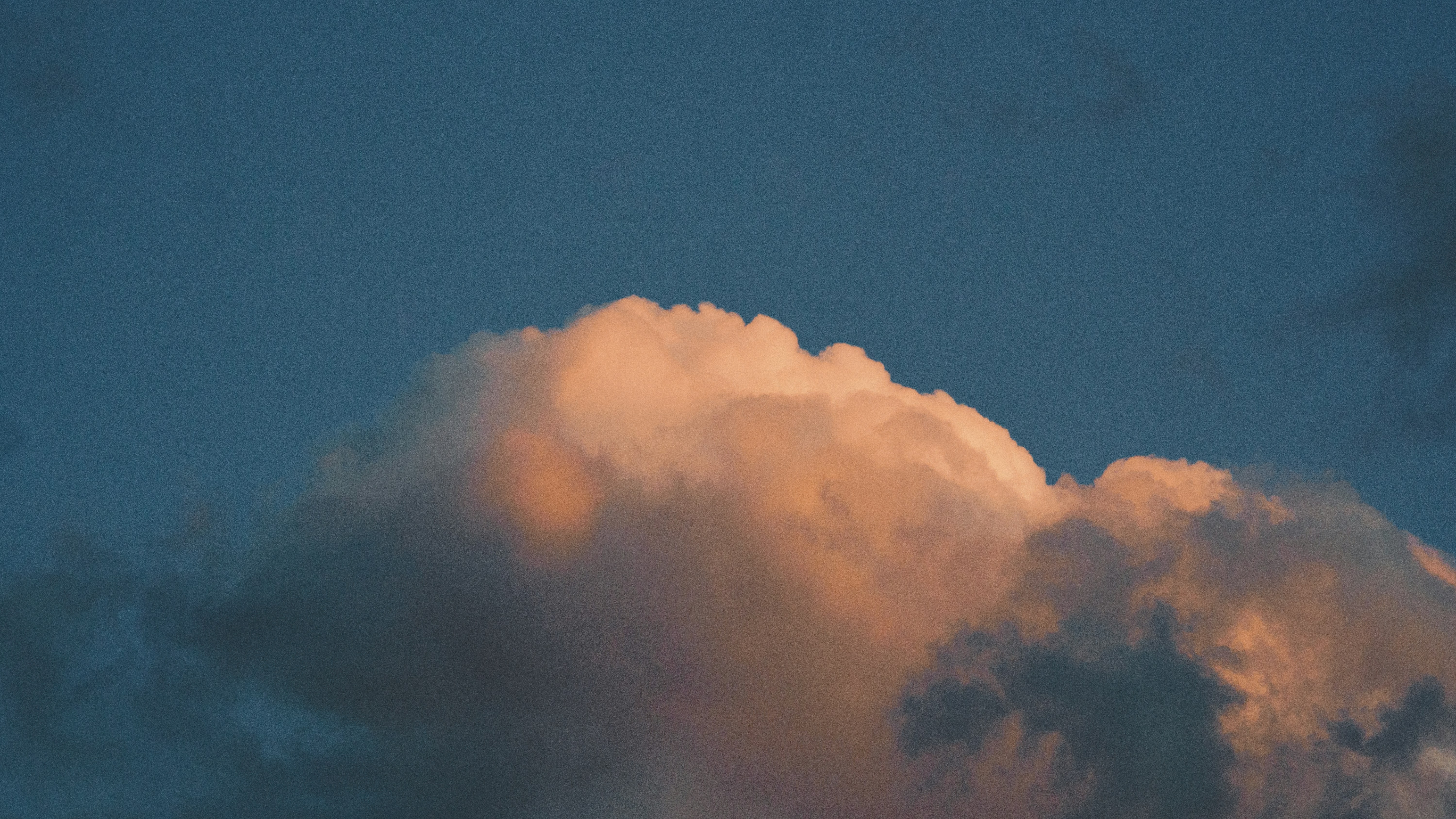 Clouds glow in the soft, sunset light.