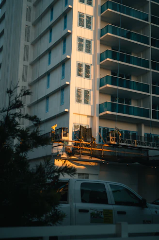A tall building bathed in golden sunlight.