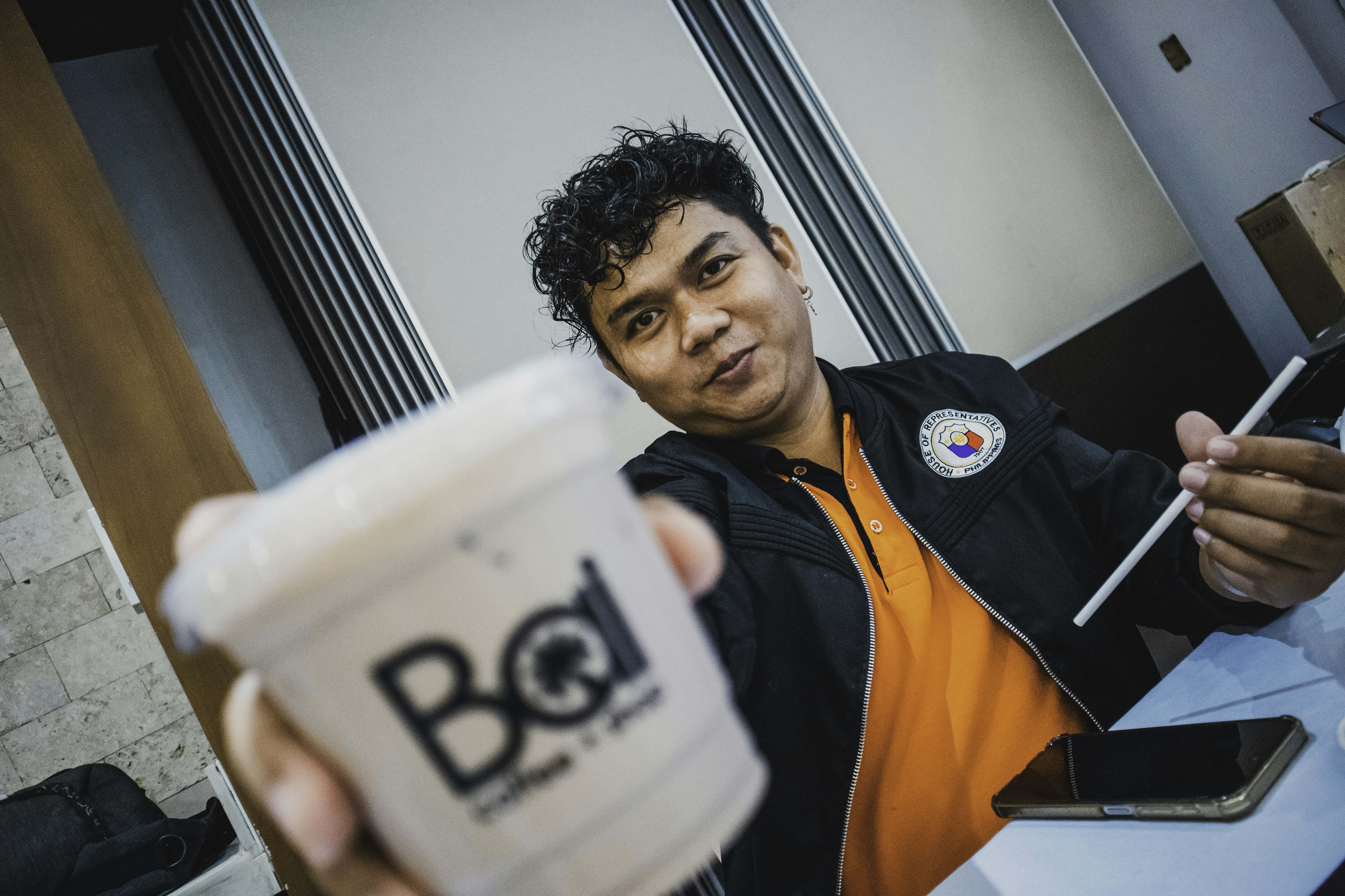 Man offers coffee.