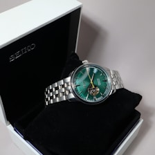 A seiko watch is displayed inside a box.