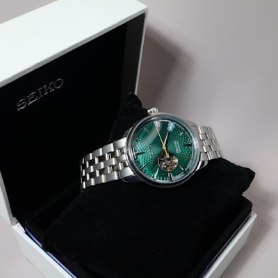 A seiko watch is displayed inside a box.