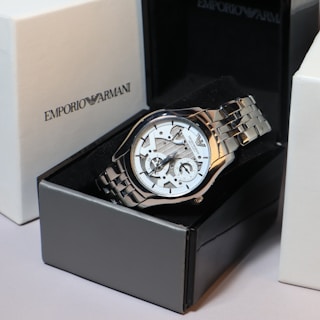 An emporio armani watch is displayed in its box.