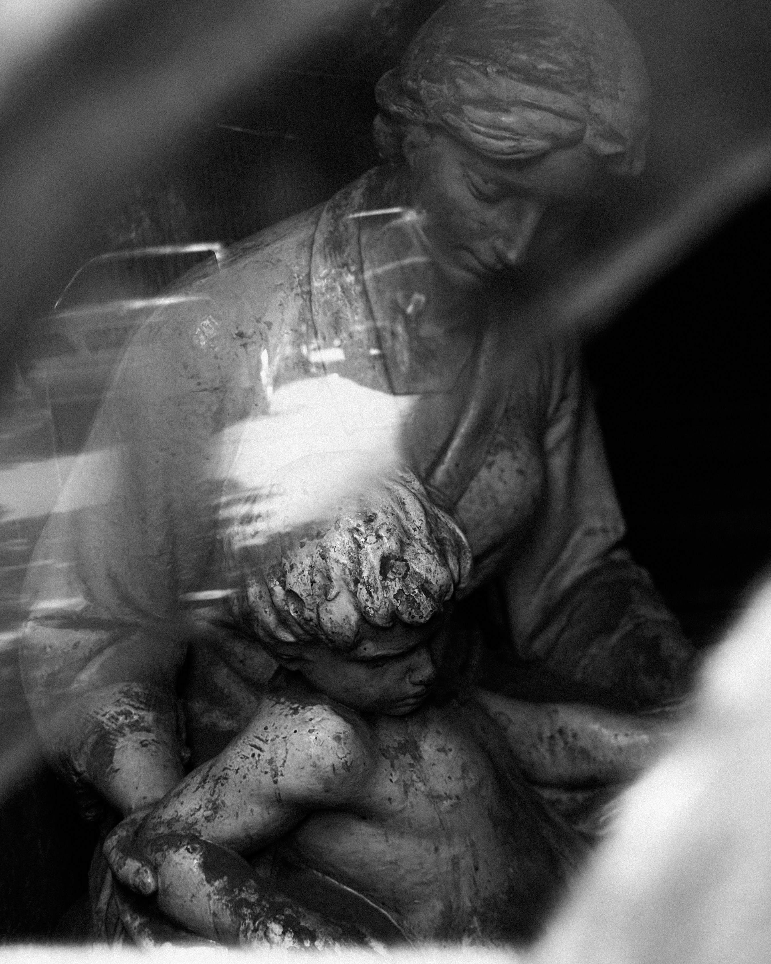 A marble sculpture of mother and child.