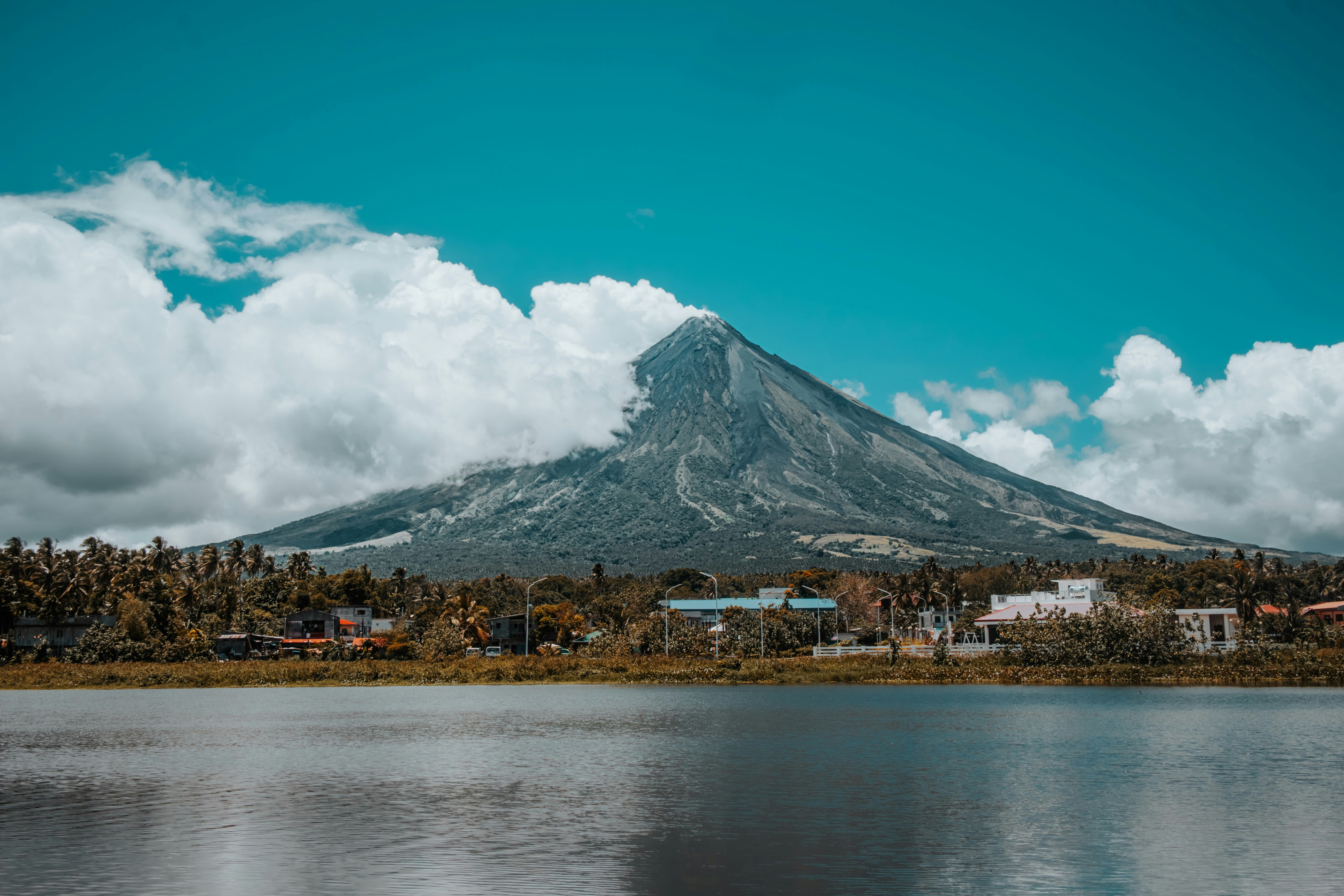 A majestic mountain rises above the water.