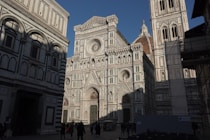 The florence cathedral stands tall in the sunshine.
