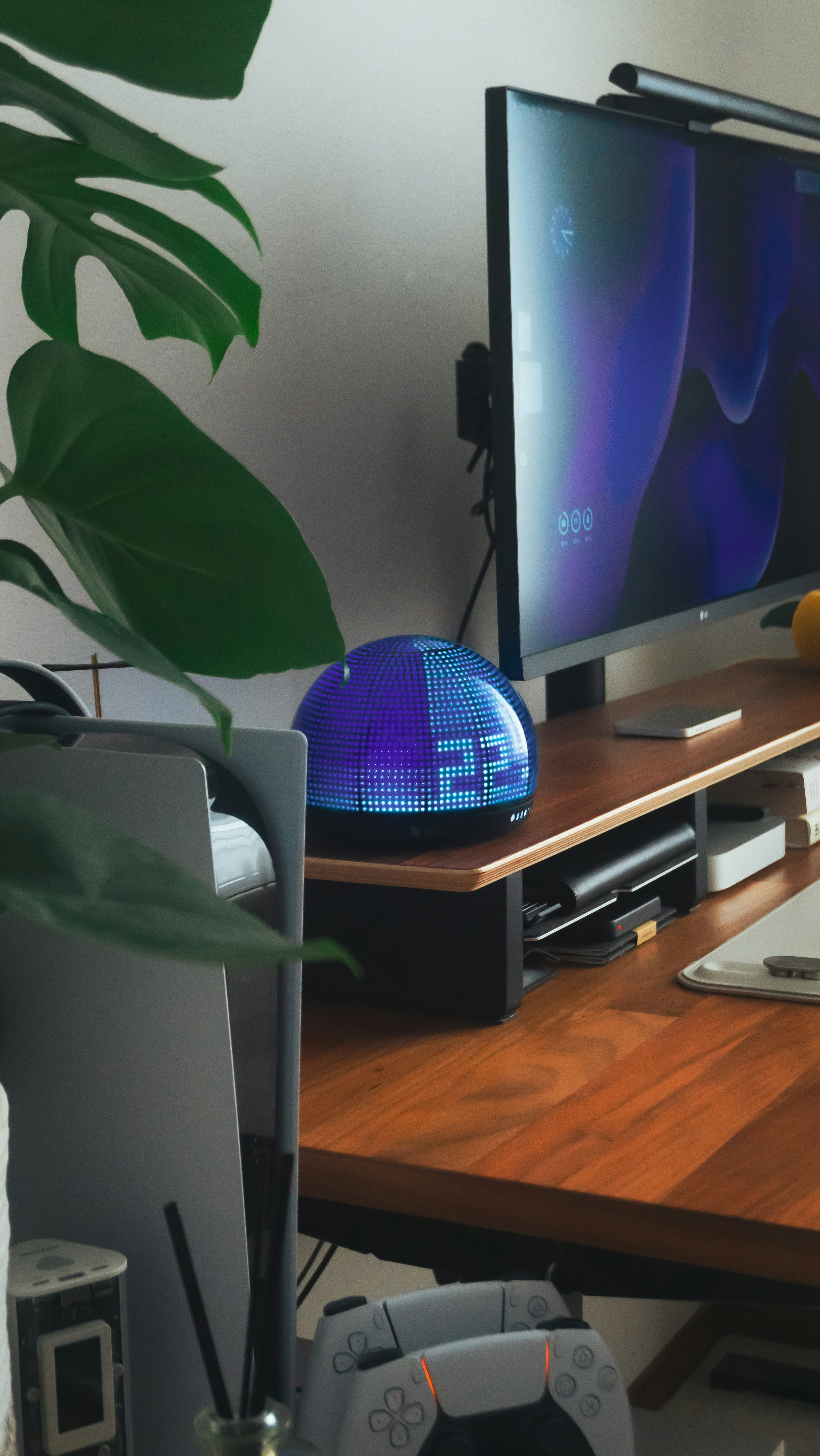A well-organized desk with a clock is pictured.