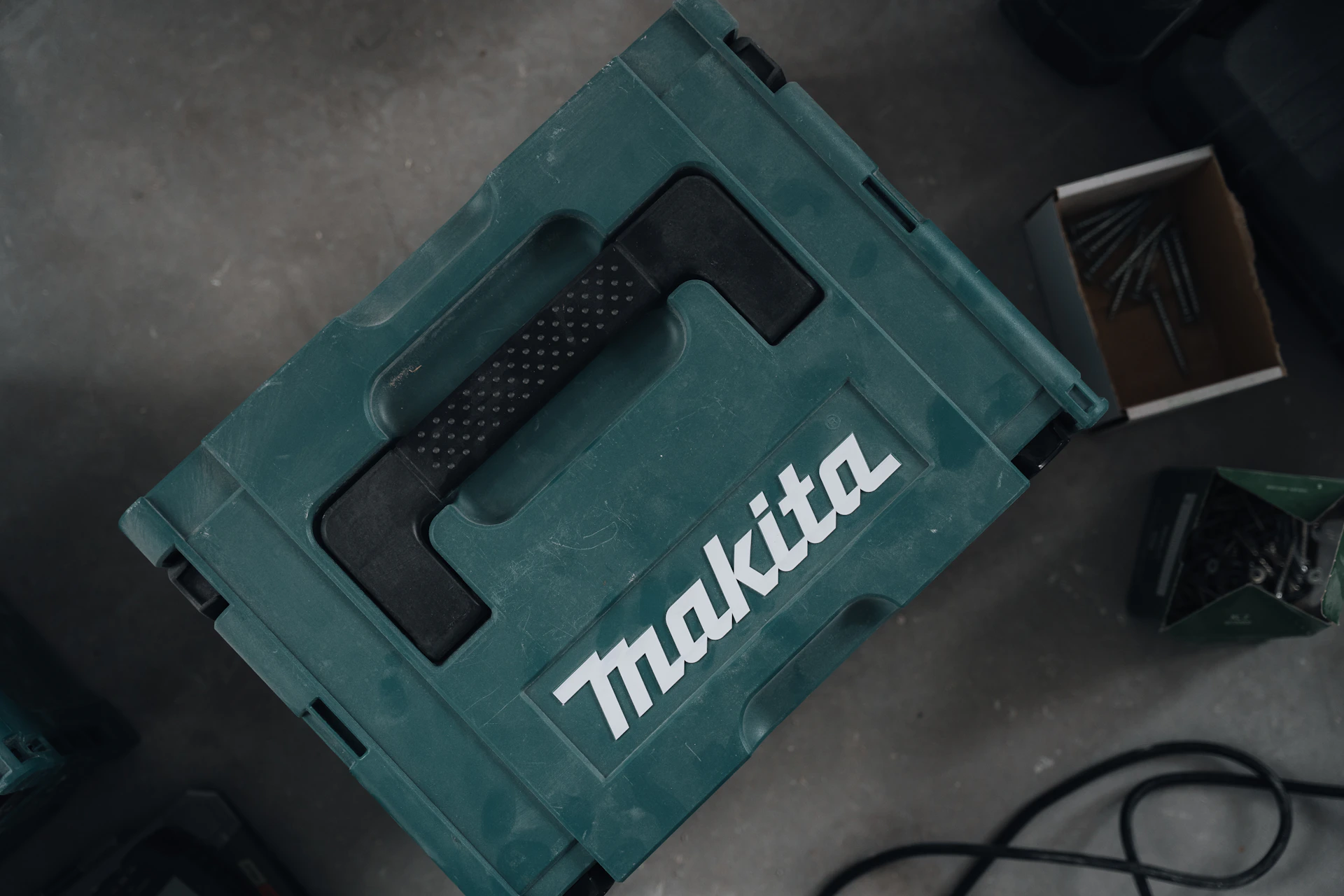 A makita container sits on a surface