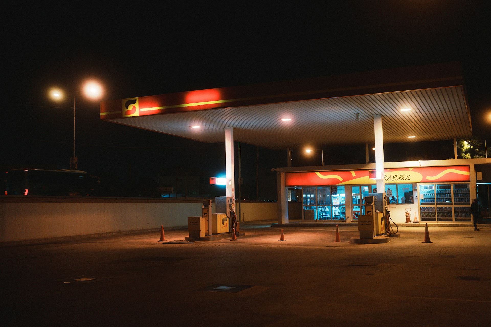 Gas station at night, lit up and empty.