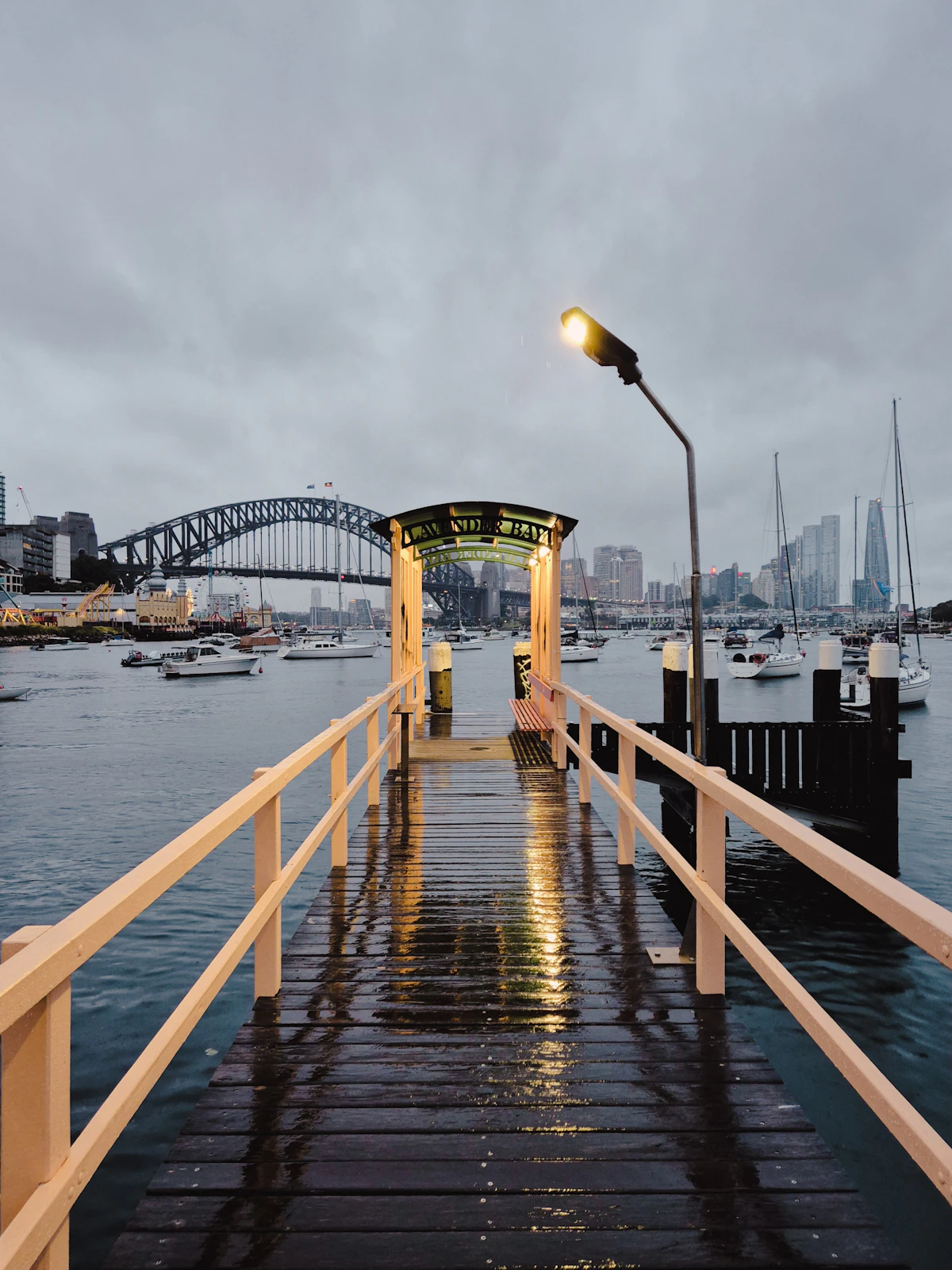Lavender Bay pier with yachts and the Sydney Harbour Bridge beyond