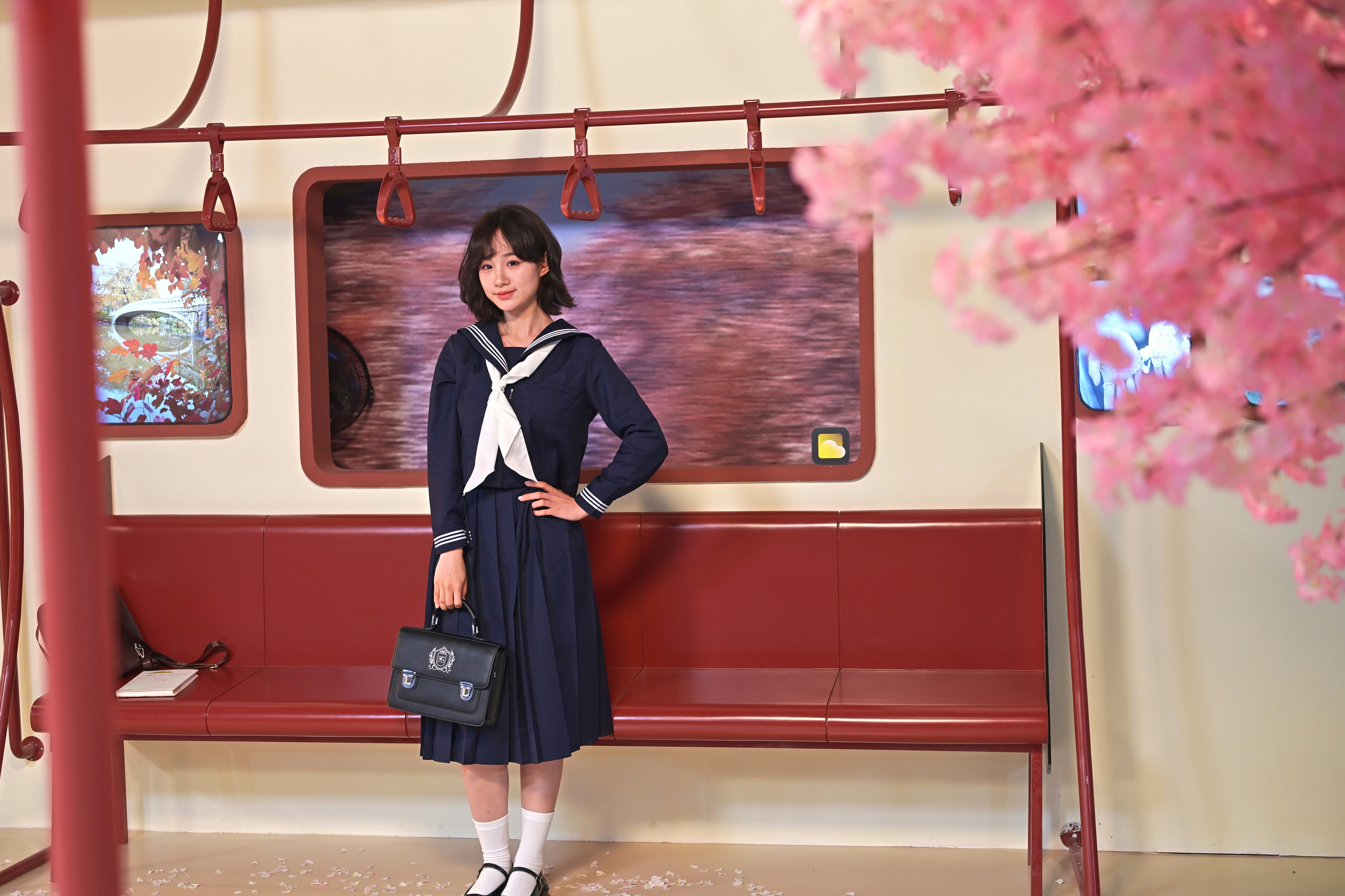 Young woman poses in a subway set.