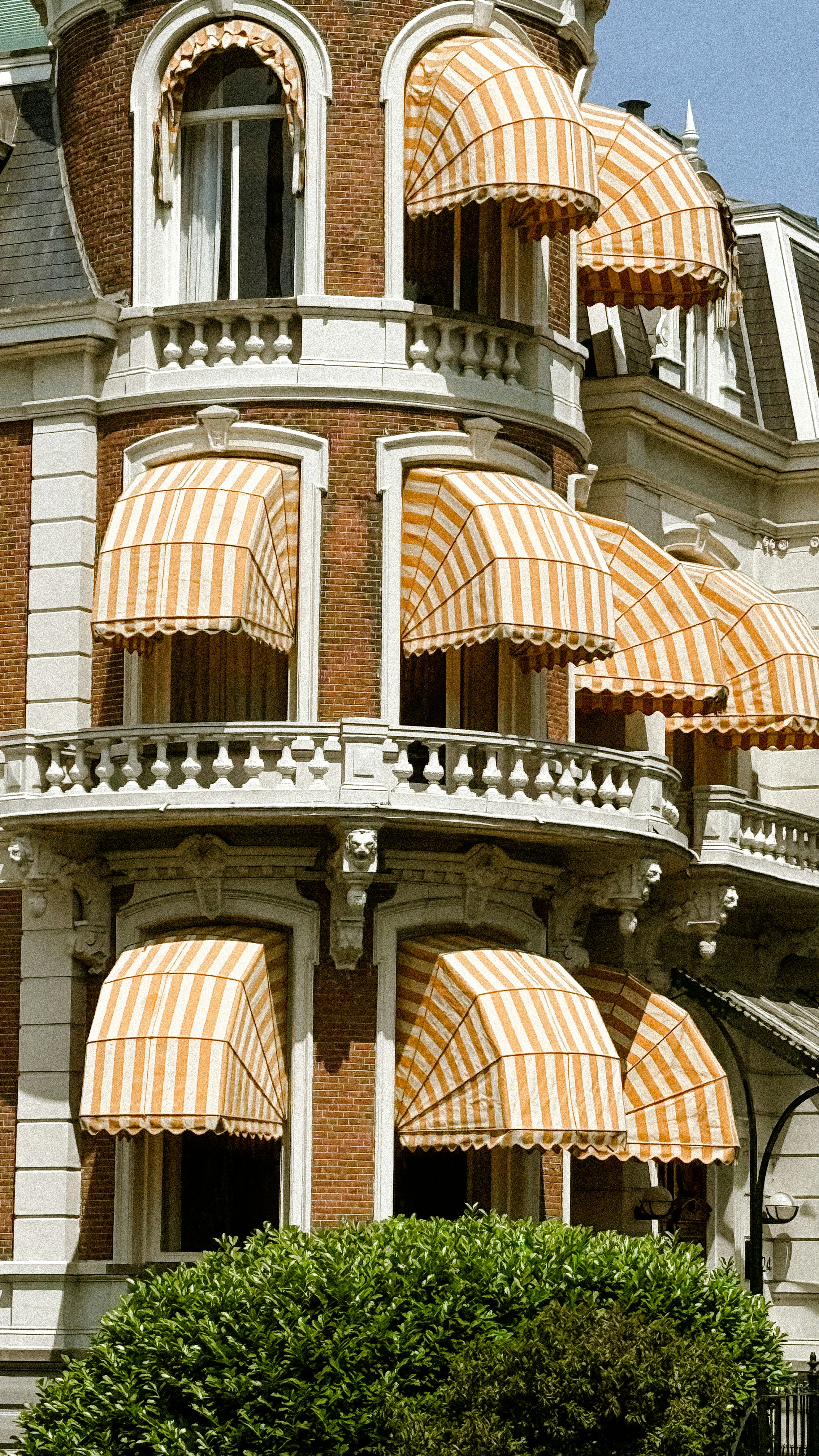 A building with multiple windows and awnings.
