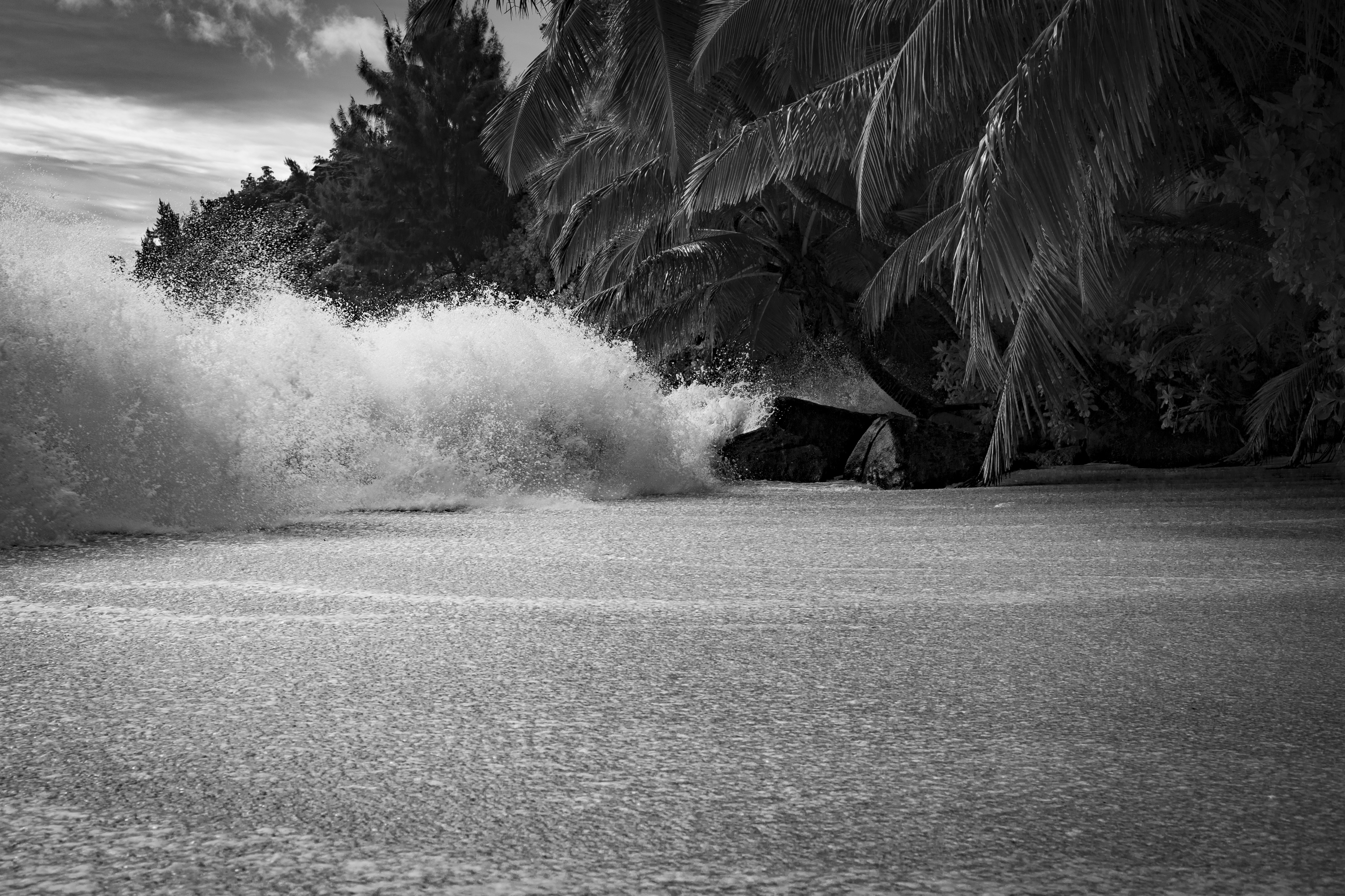 A crashing wave hits a shore.