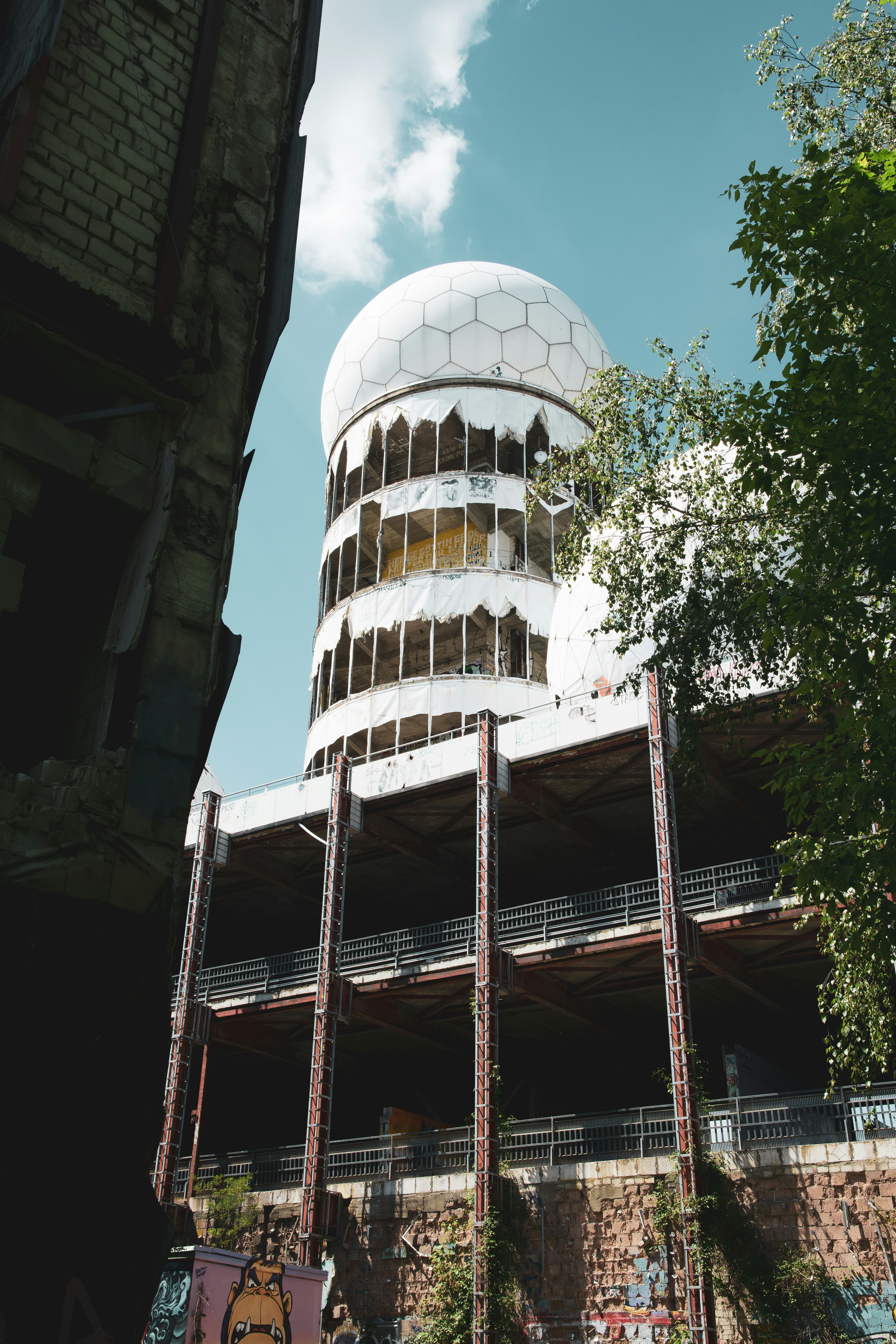 An old building with a dome under a clear sky.