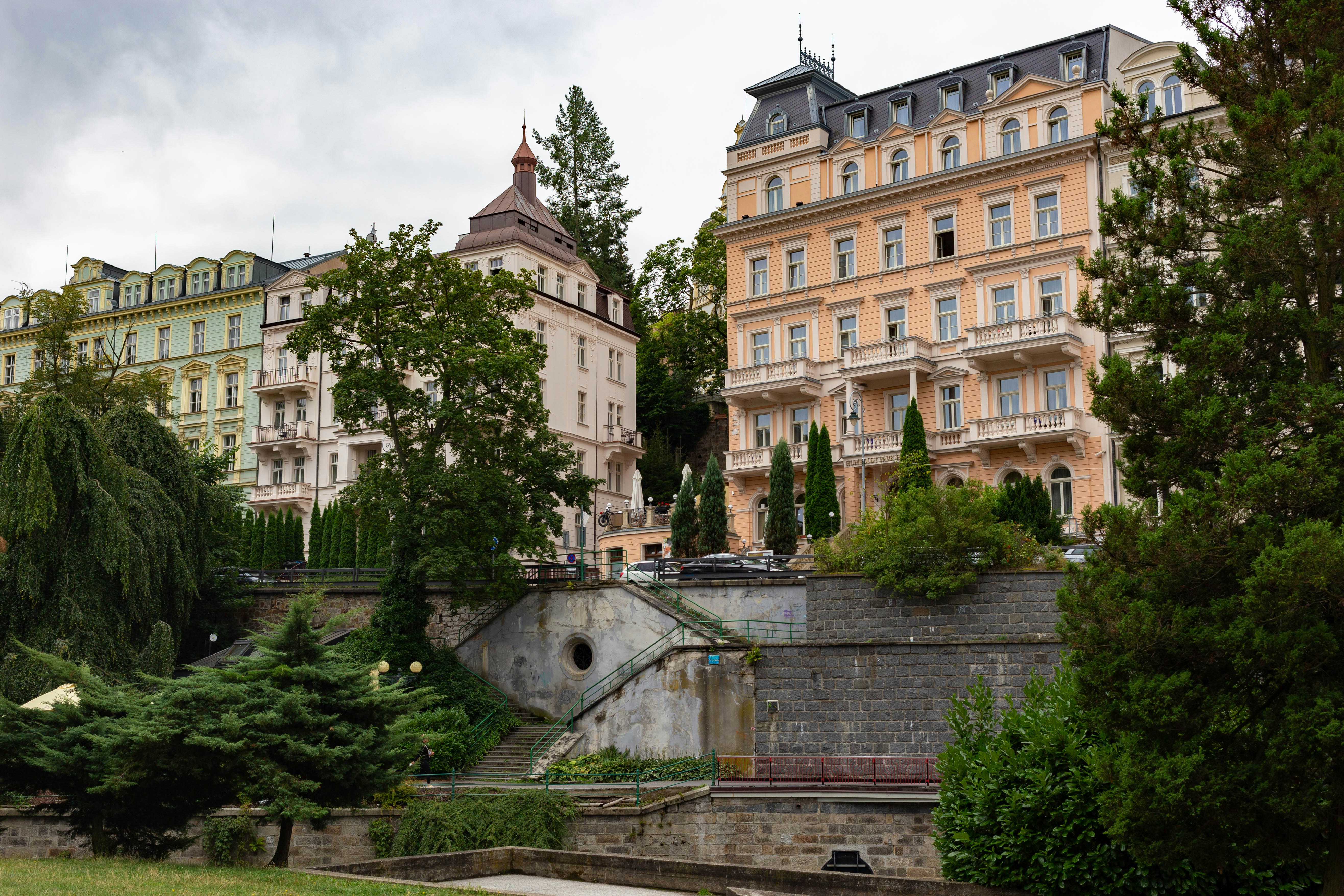 Elegant buildings stand amidst lush greenery.