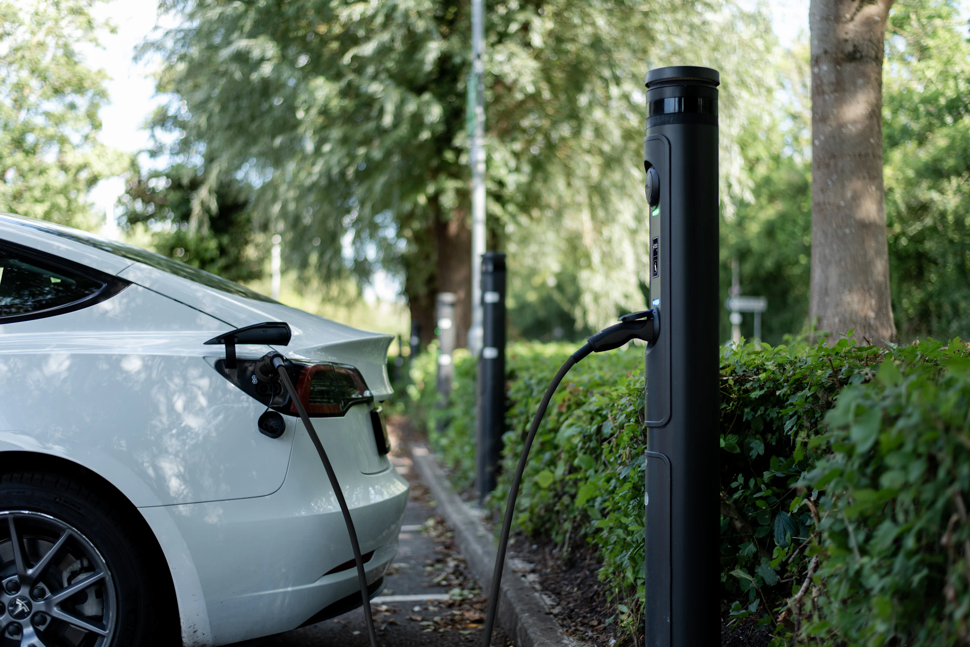 An electric car is charging at a station