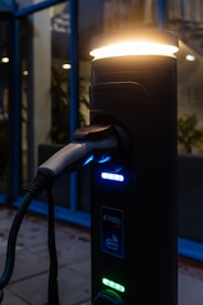 An electric vehicle charging station is illuminated.