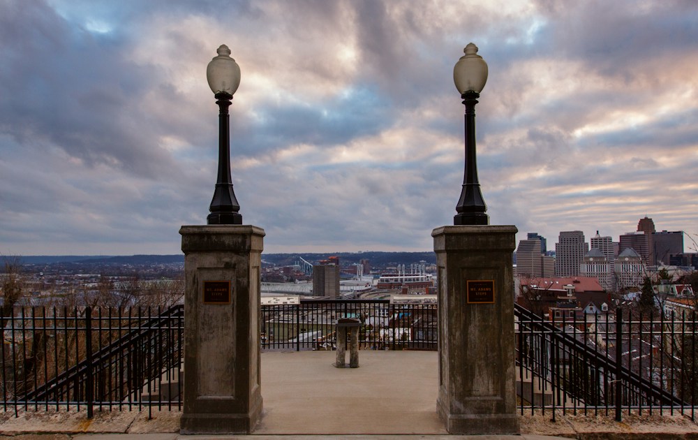 View of a city framed by two lamp posts