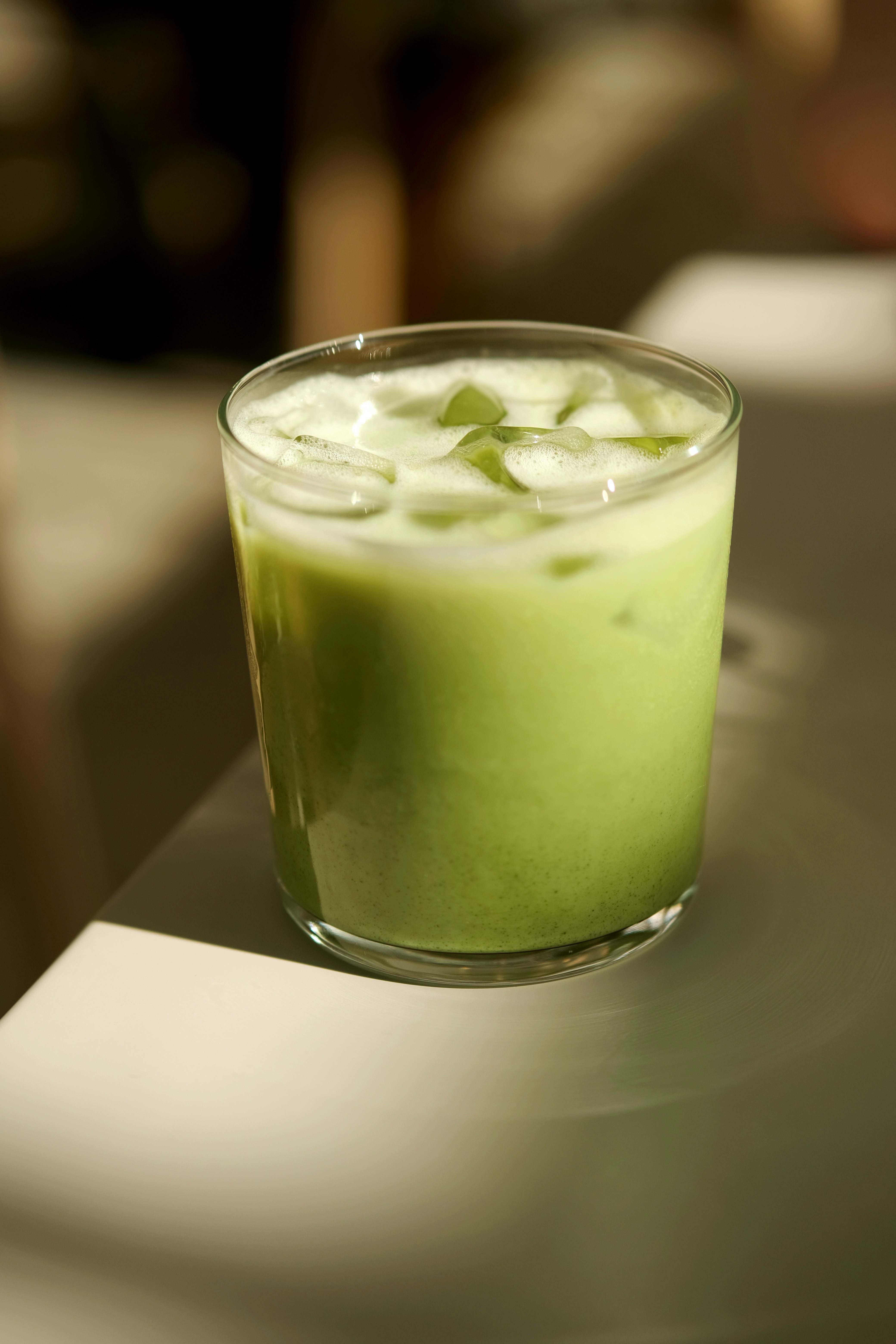 A glass of refreshing matcha iced latte.