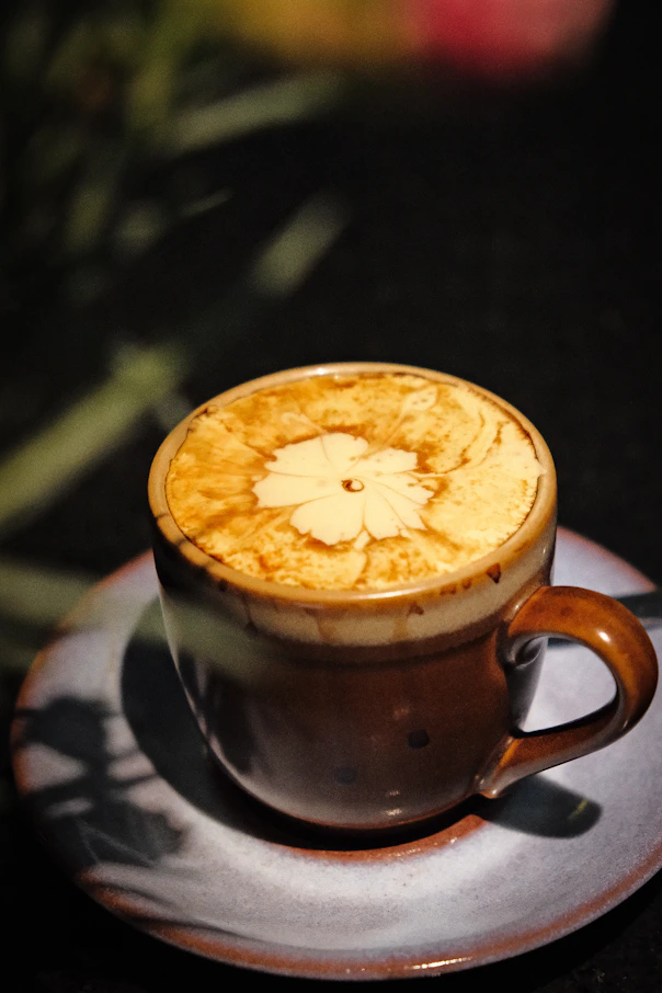 Delicious vietnamese egg coffee with a flower design.