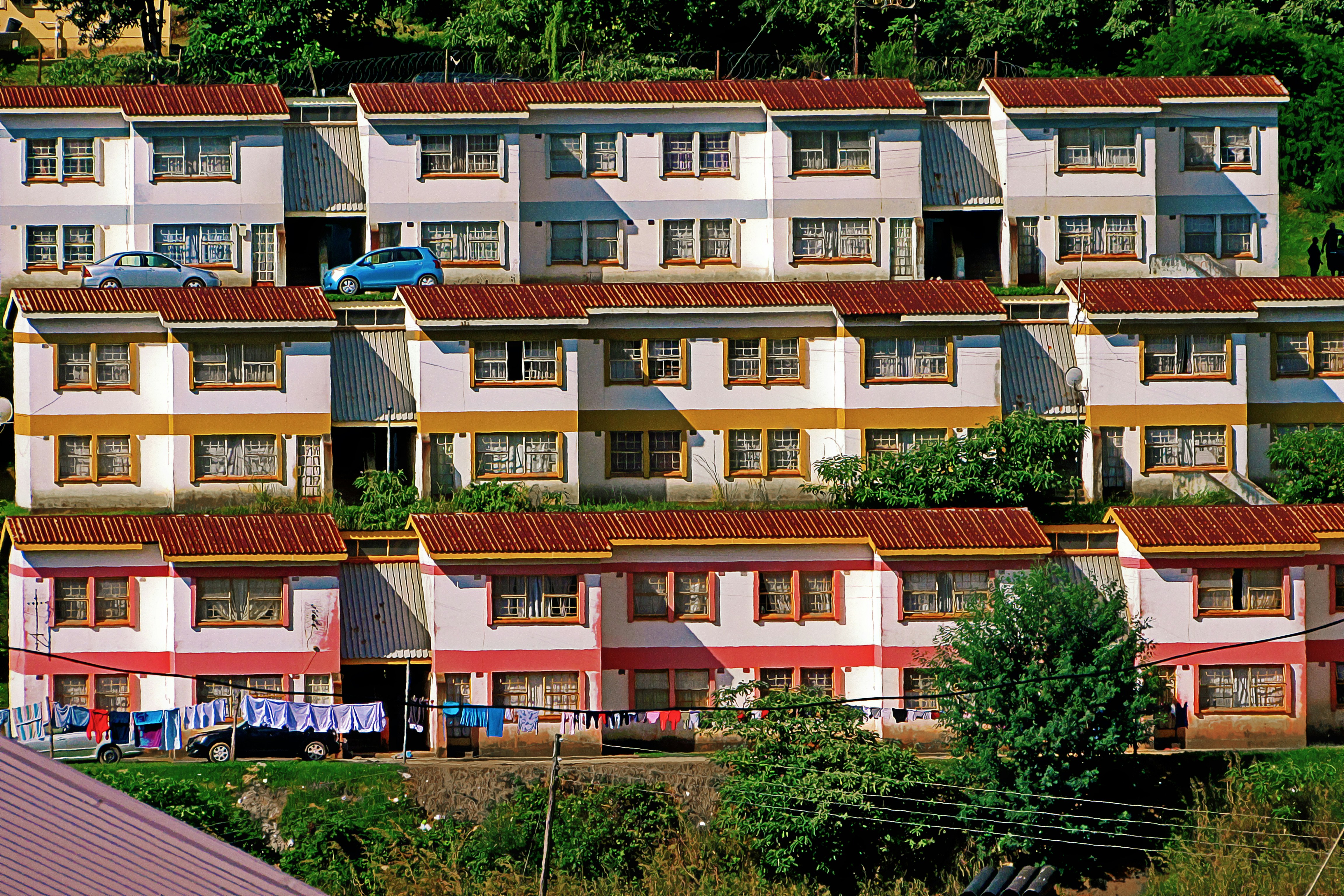 Complex of colorful two-story houses representing local architecture and accommodation options.