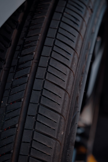 Close-up of a car tire tread showing tread depth and wear patterns