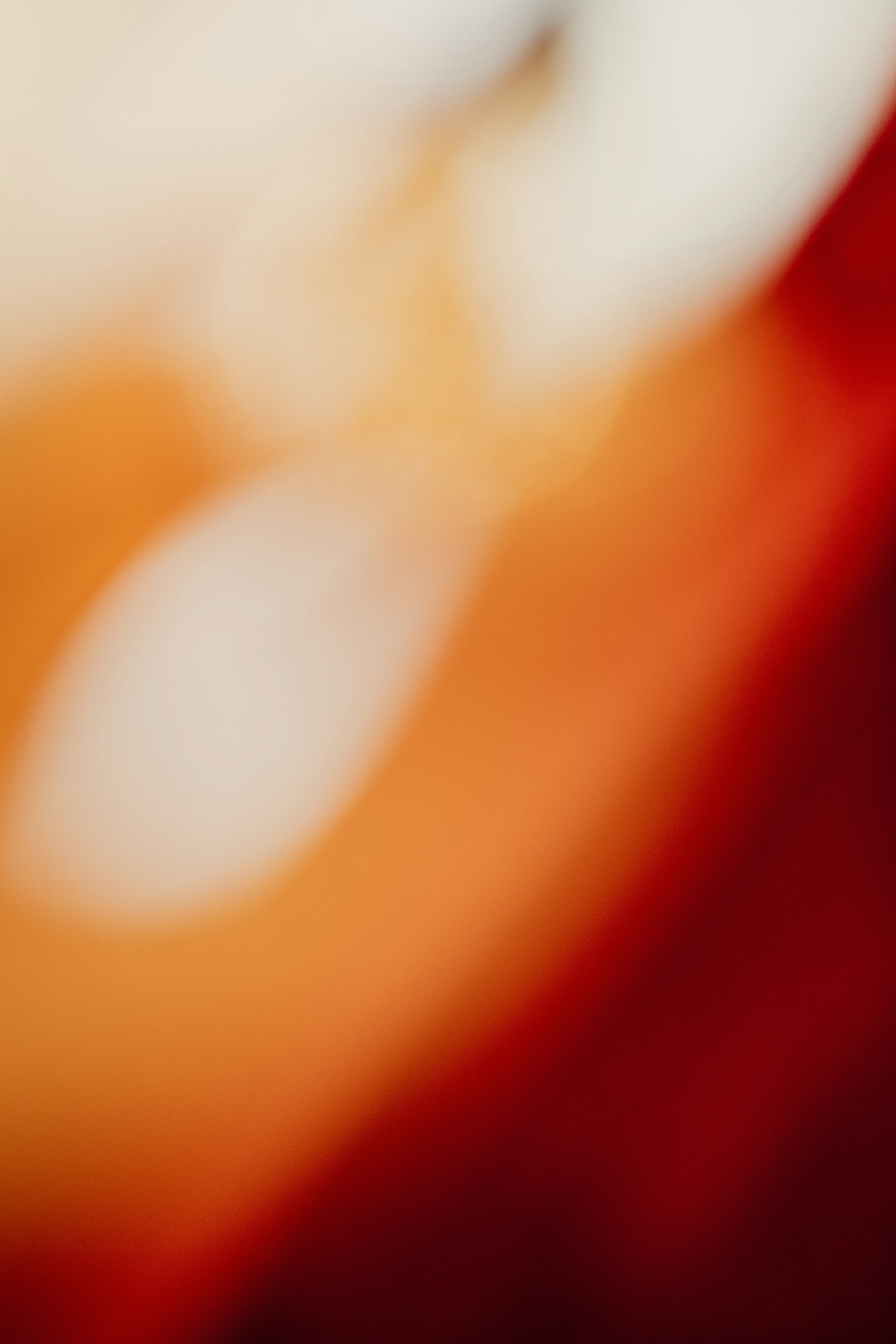 Blurred colors blend together in a soft, abstract pattern.