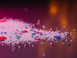 Laundry detergent granules are close-up.