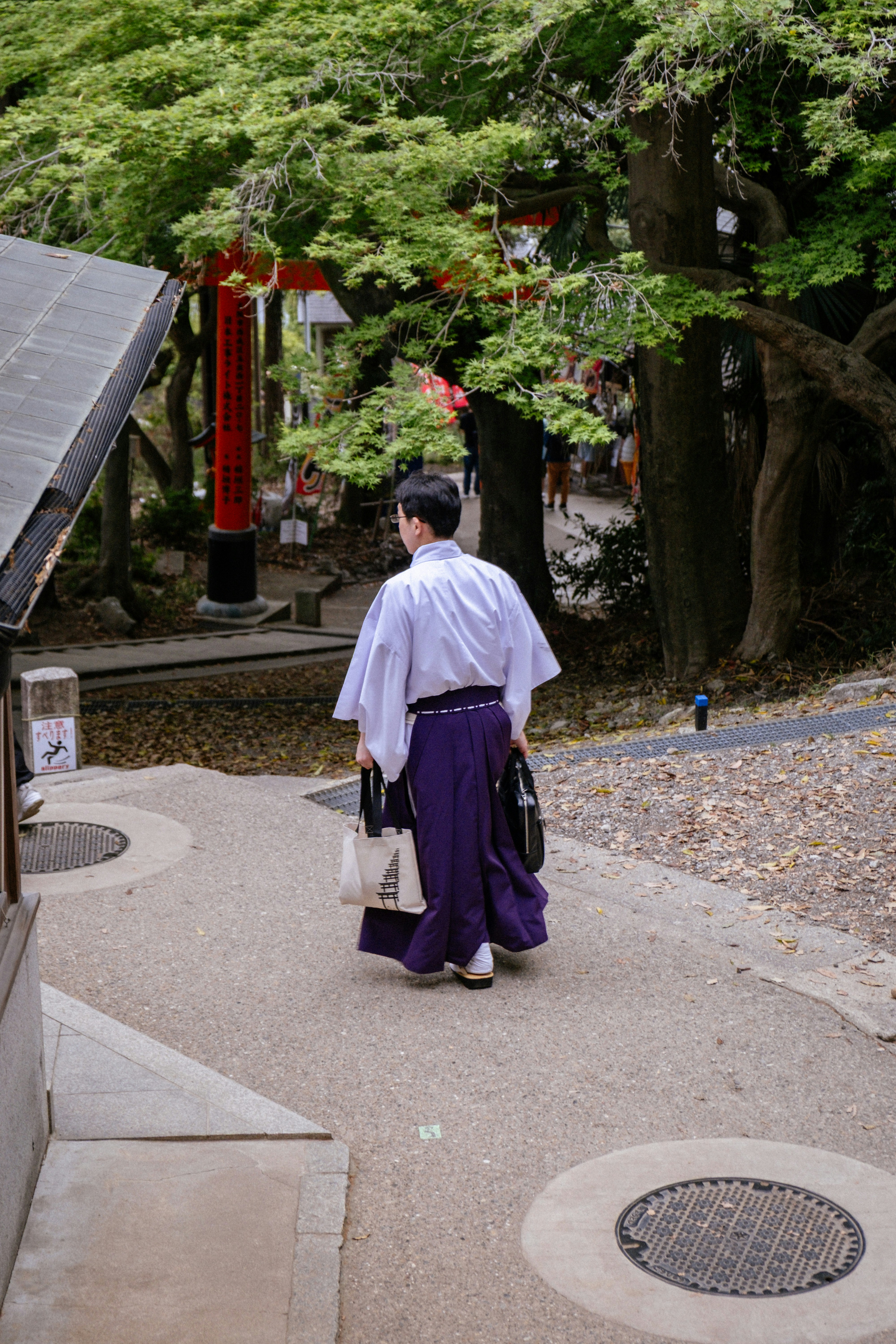 A man in traditional garb walks forward.