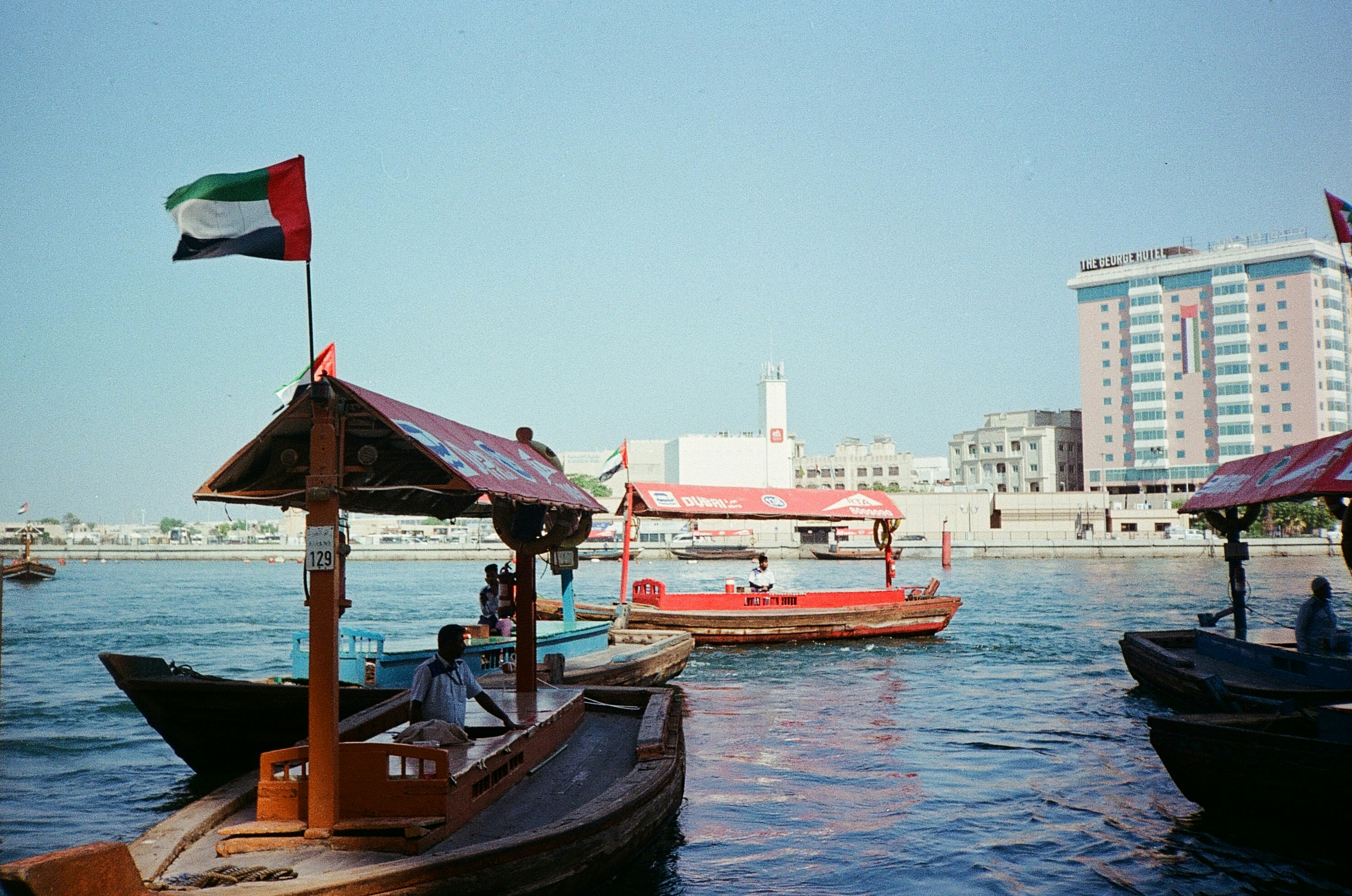 Boats with the uae flag on the water.