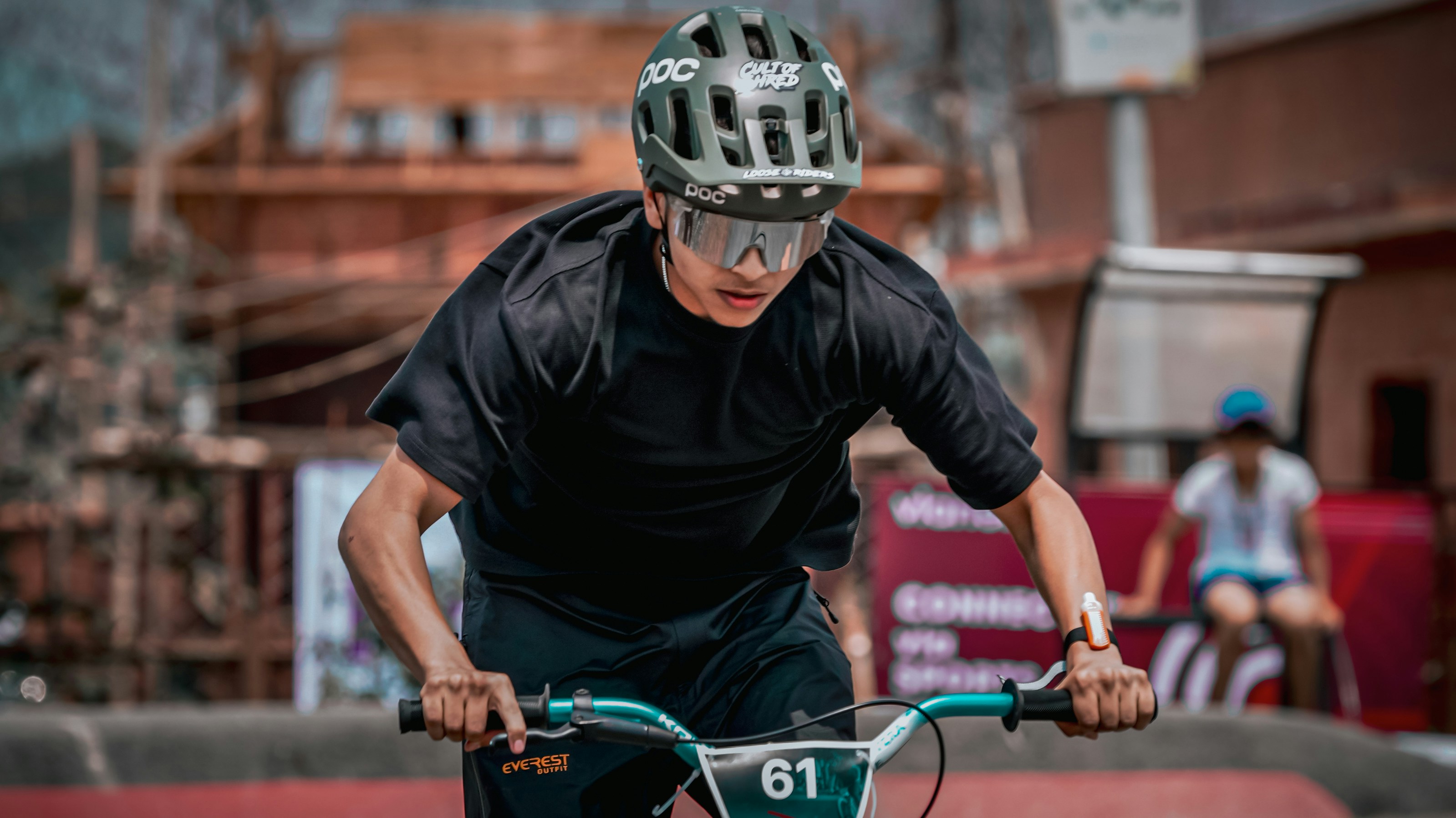 A cyclist rides his bike.