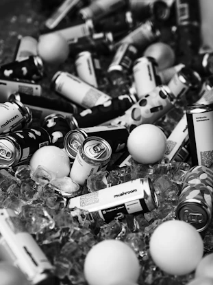 Beer cans and ping pong balls in ice.