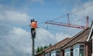 A lineman works on power lines.