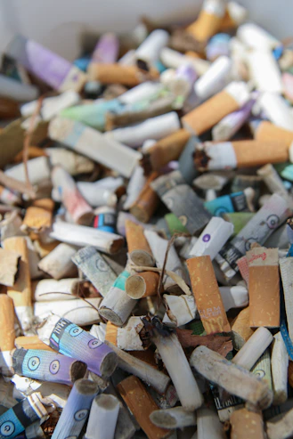 A large pile of used cigarette butts