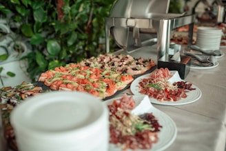 A buffet table displays appetizers and dishes.