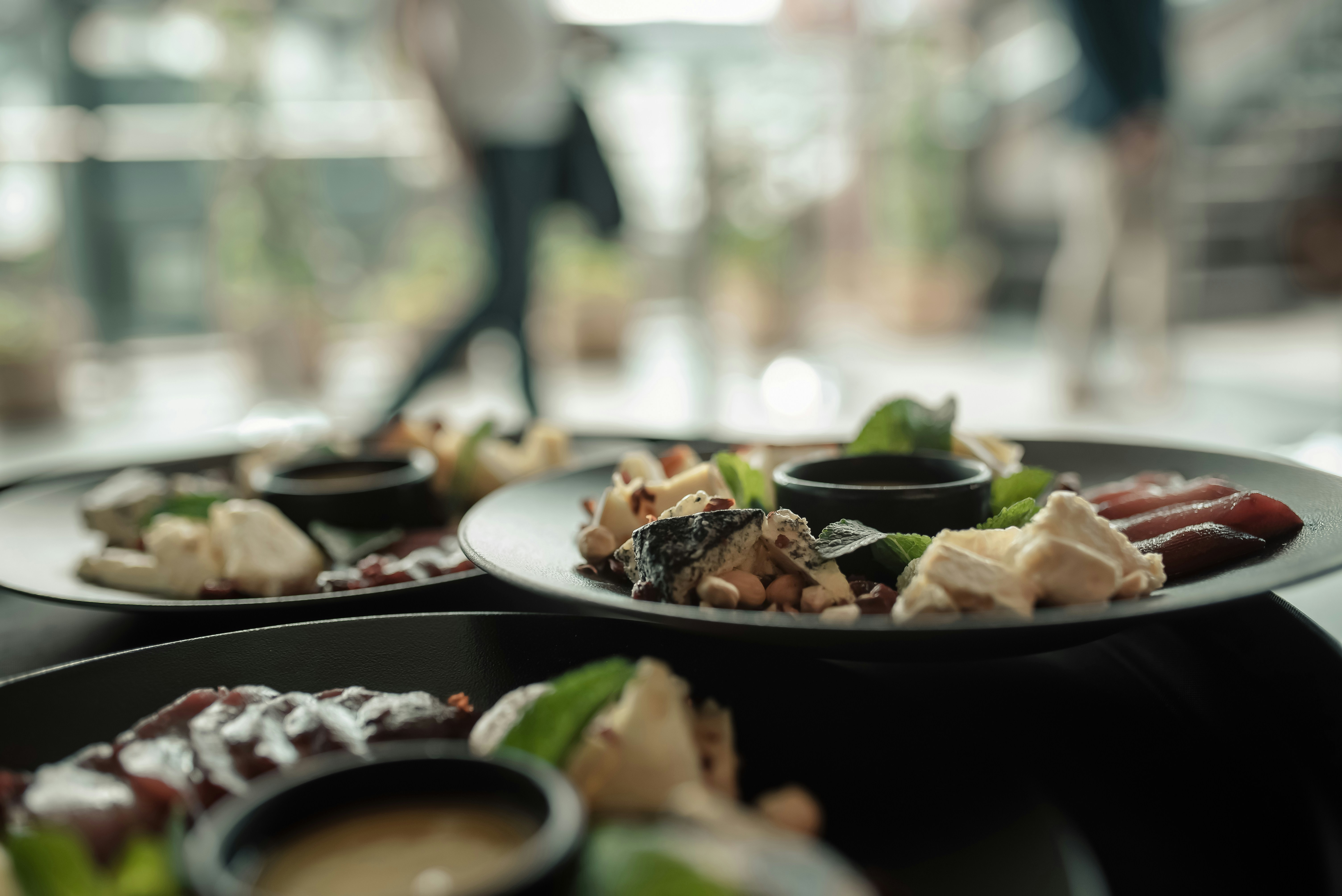 Plates of food are served in a restaurant