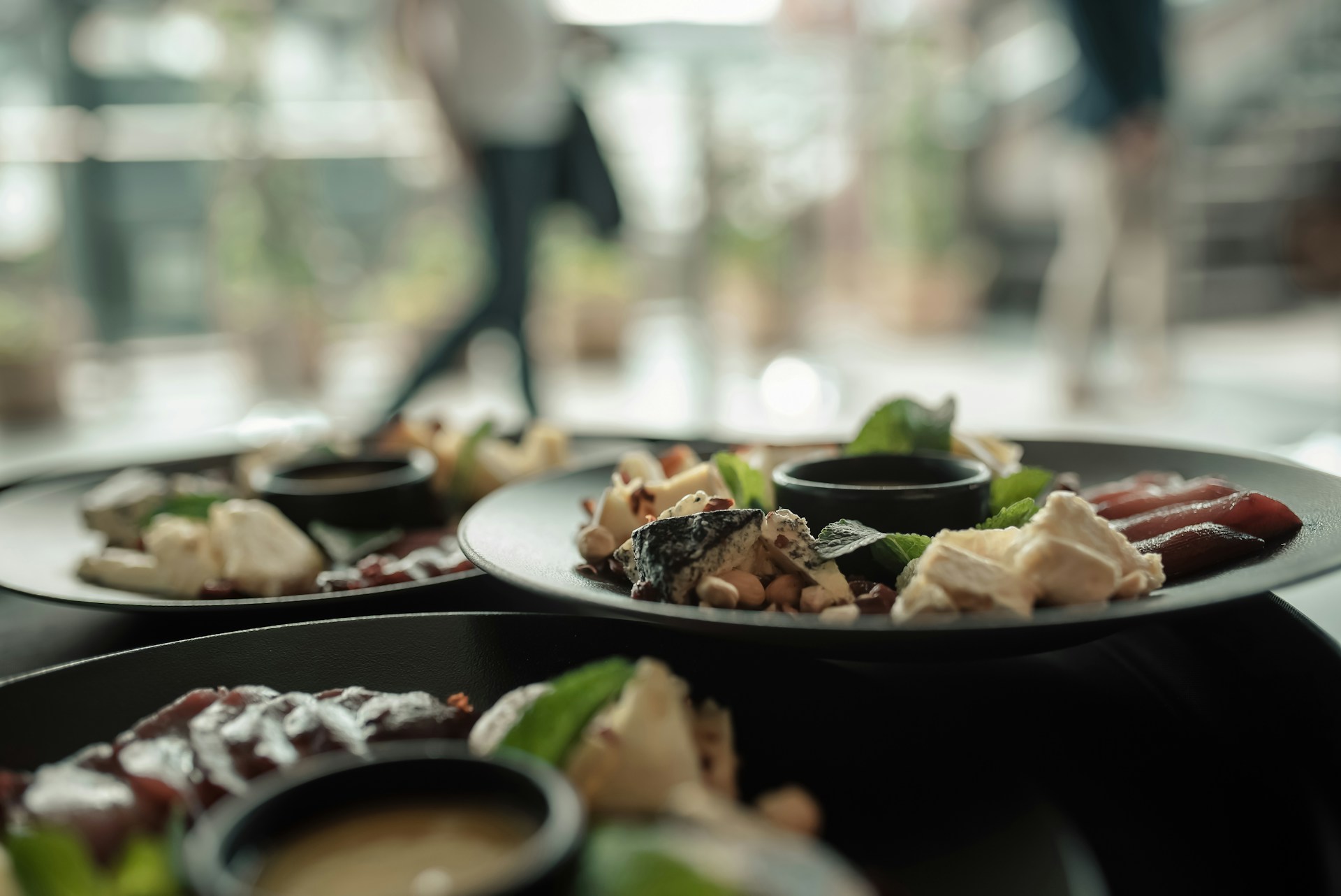 Plates of food are served in a restaurant.