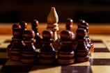 A bishop is surrounded by pawns on a chessboard.