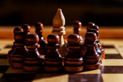 A bishop is surrounded by pawns on a chessboard.
