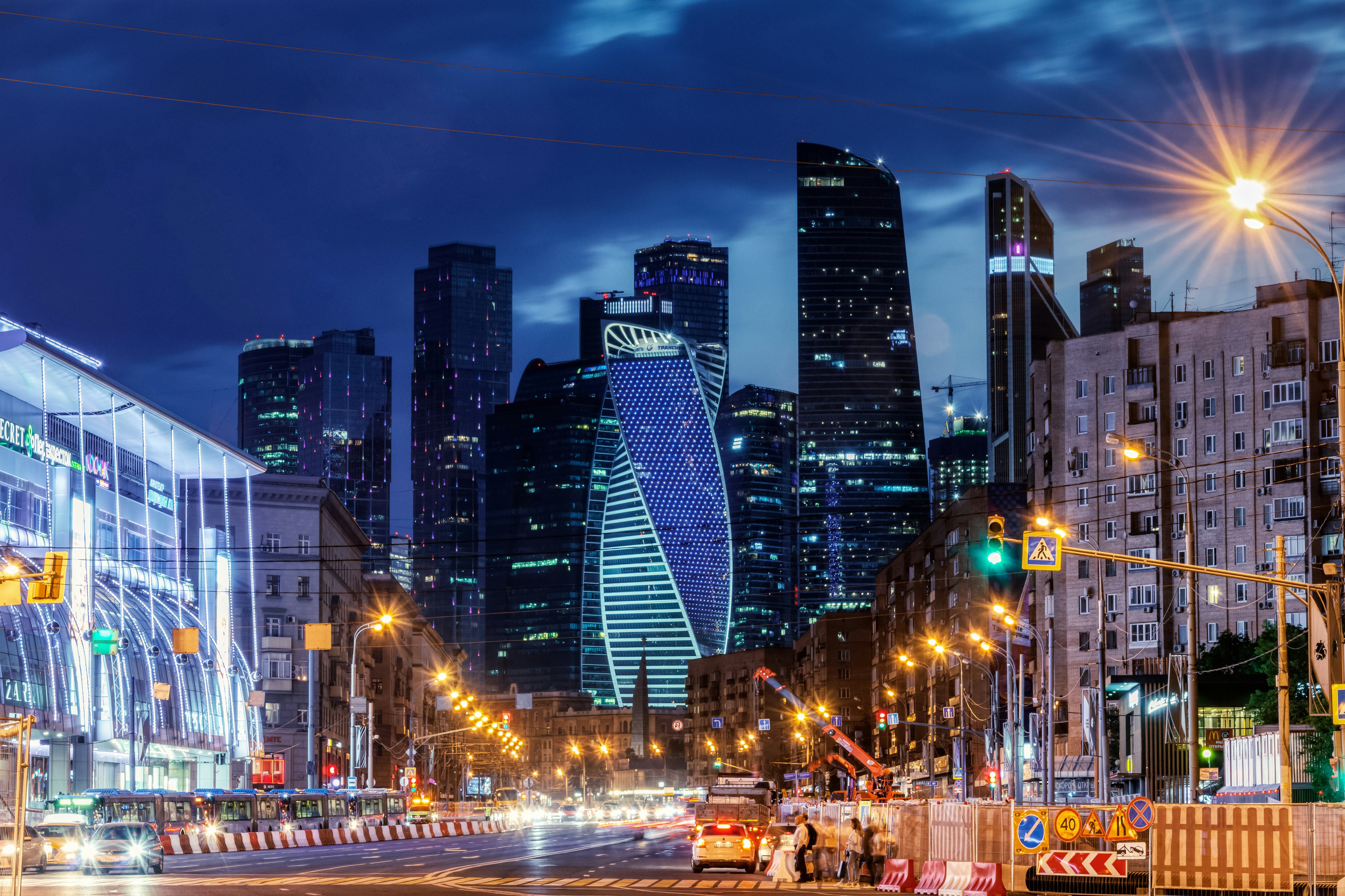 Night view of a city with tall illuminated skyscrapers. photo – Free ...