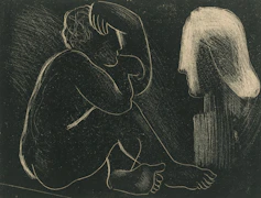 A figure sits contemplating a bust in profile bust